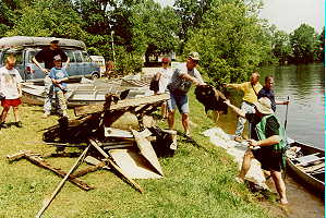 John unloading a mammoth load 
of refuse from his canoe.