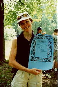 Linda showing off her celtic-style
 award, suitable for framing.