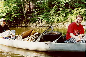 Mike and Ben with 
a canoe full of junque.