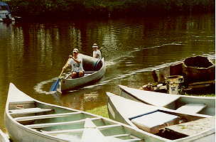 Nancy and her son Ryan arrive
 with a full canoe.